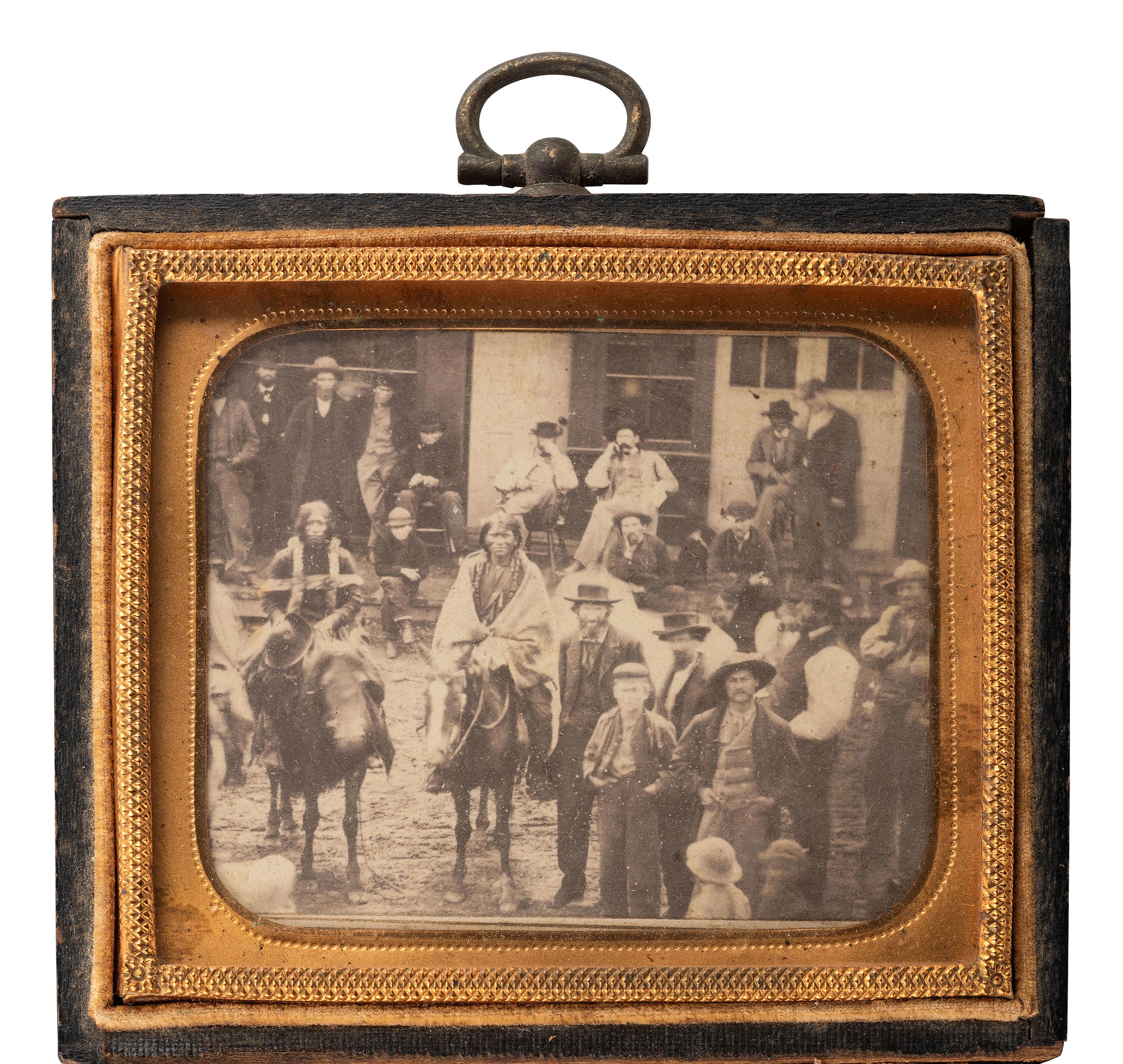 [NATIVE AMERICANS]. [MCKENNY, A.S., photographer]. CDV of street scene featuring Ute Indians on horseback. [Black Hawk, Colorado Territory], Ca 1870.