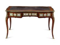 A Louis XV Style Gilt Bronze and Sèvres Style Porcelain Mounted Kingwood Bureau Plat