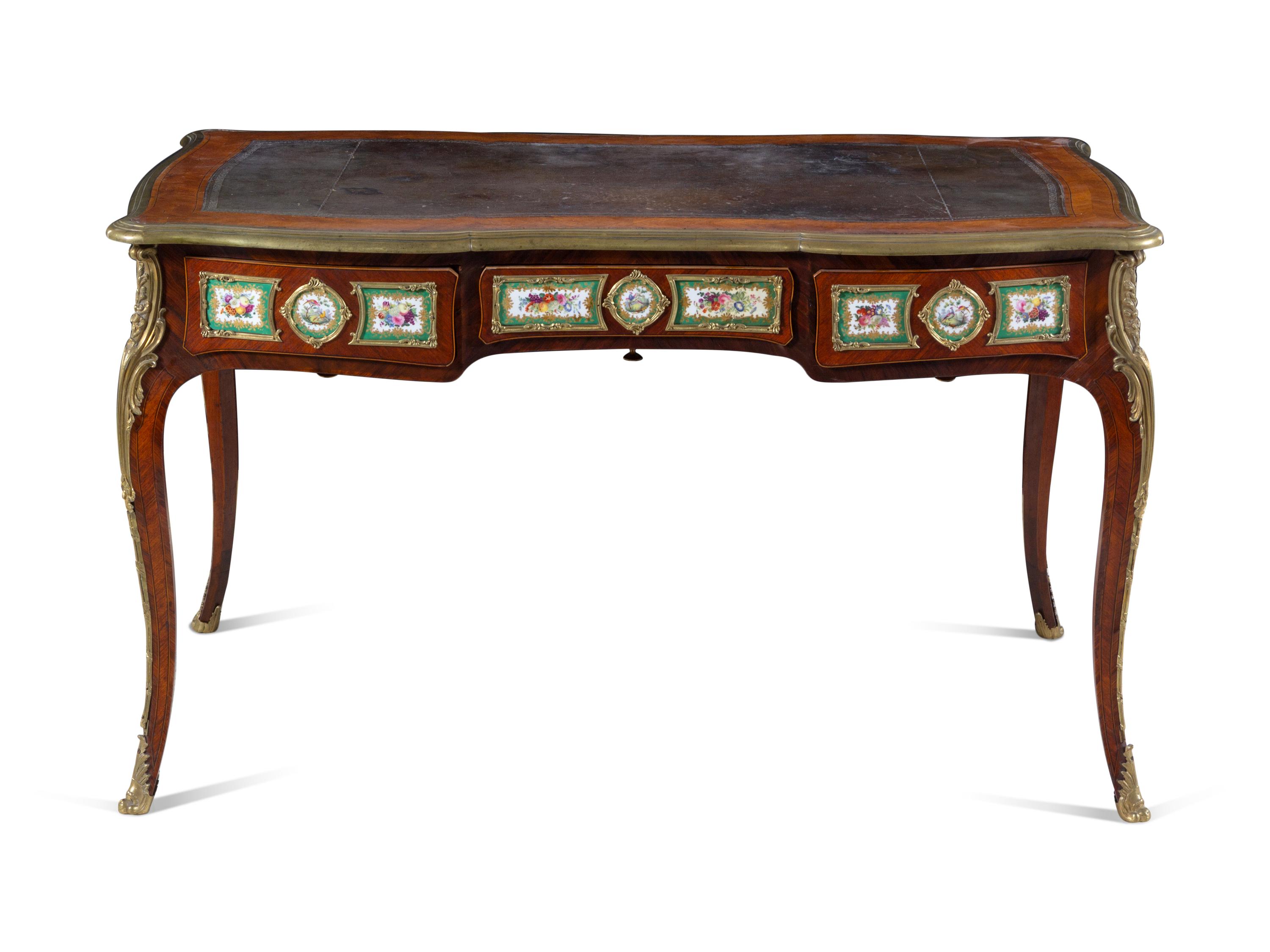 A Louis XV Style Gilt Bronze and Sèvres Style Porcelain Mounted Kingwood Bureau Plat