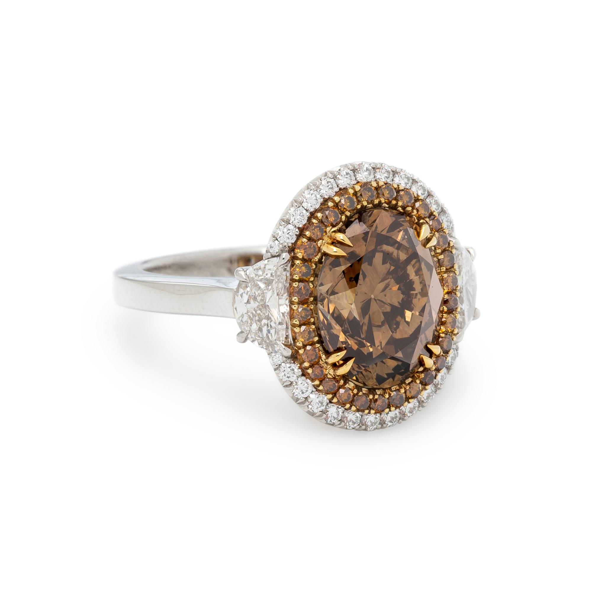 FANCY DARK YELLOWISH BROWN DIAMOND AND DIAMOND RING