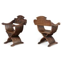A Pair of Italian Carved Walnut Savonarola Chairs