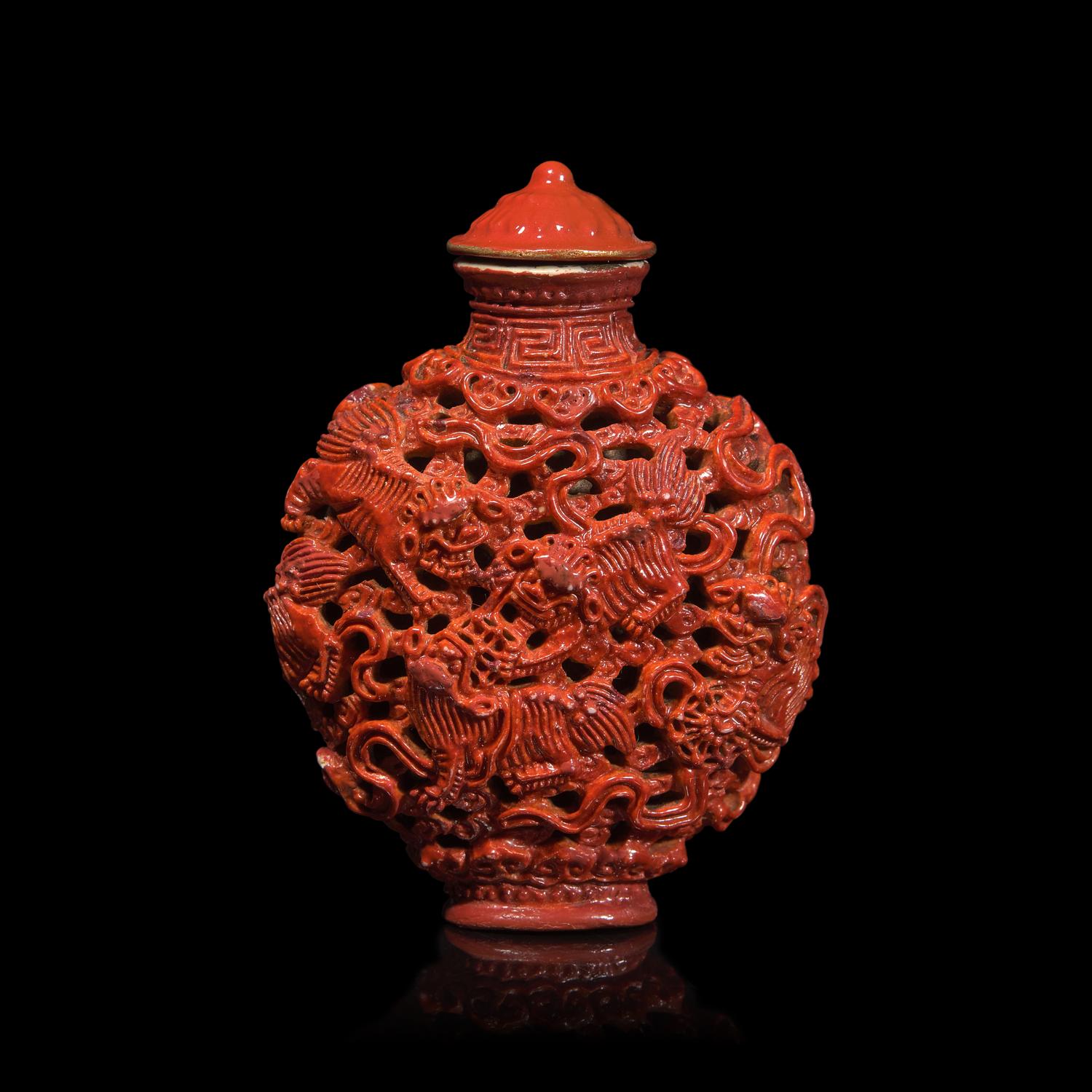 A Chinese Coral Glazed Reticulated Porcelain Snuff Bottle, Jiaqing Mark
