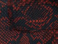 Seven Designer Scarves: One Brunello Cucinelli, Two Eskandar, One Akris, One Hermès, One Loro Piana, One Yves Saint Laurent Rive Gauche