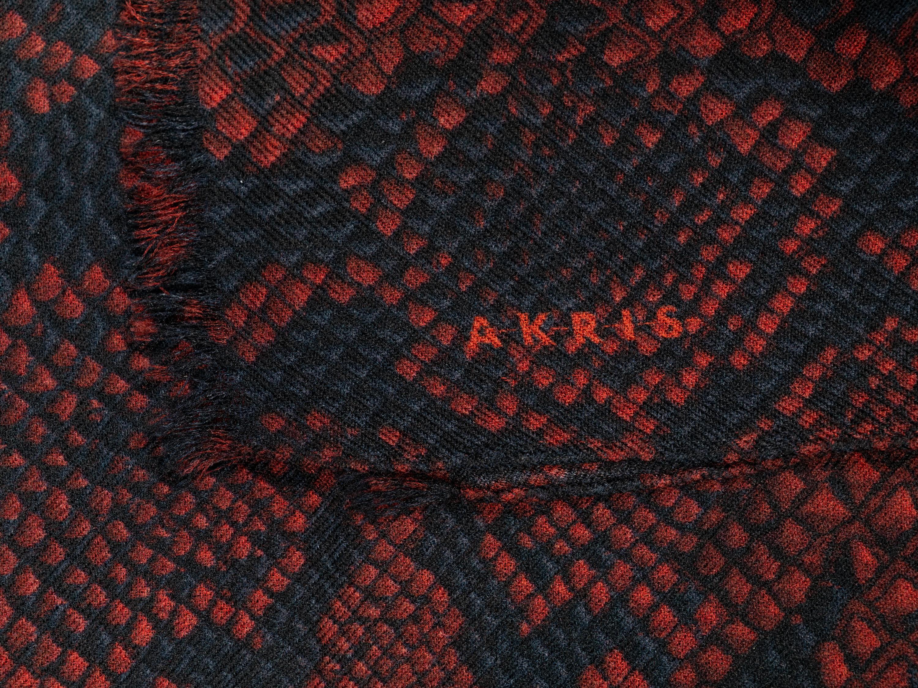 Seven Designer Scarves: One Brunello Cucinelli, Two Eskandar, One Akris, One Hermès, One Loro Piana, One Yves Saint Laurent Rive Gauche