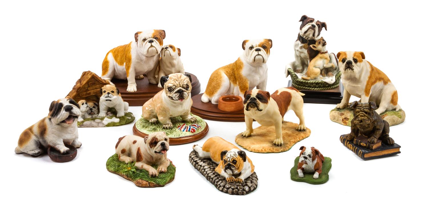 A Group of Twelve Ceramic Bulldog Figures Width of widest 8 1/2 inches.