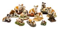 A Group of Twelve Ceramic Bulldog Figures Width of widest 8 1/2 inches.