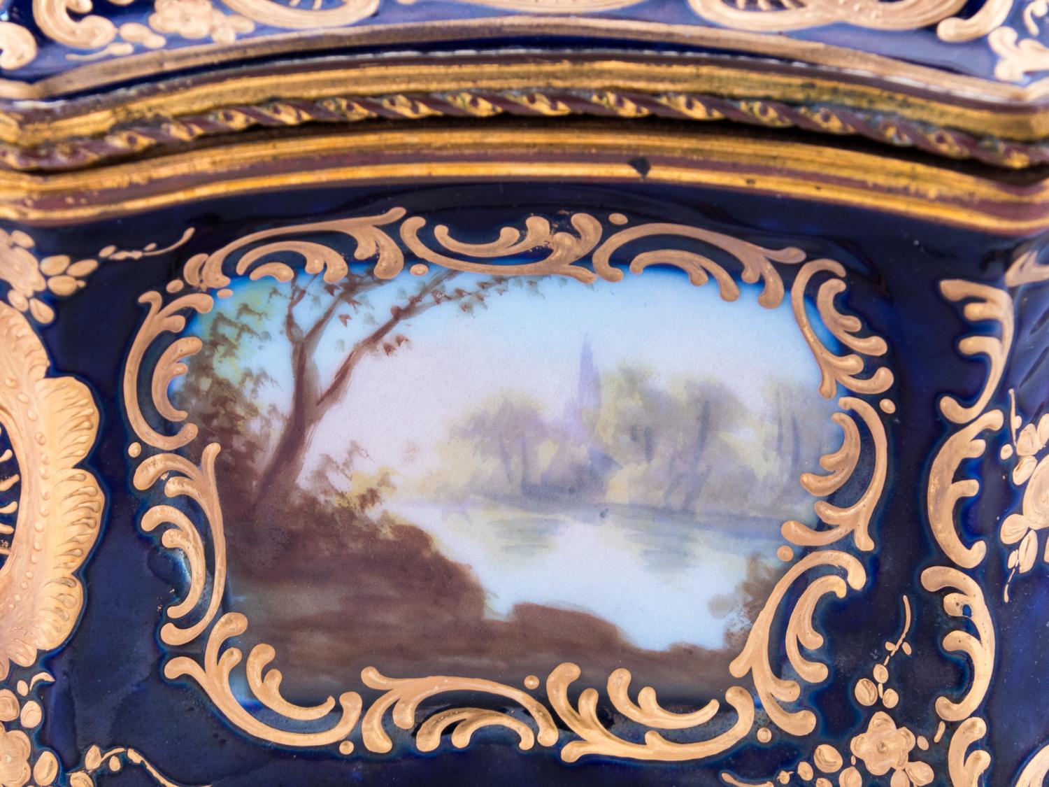 A Sèvres Style Painted and Parcel Gilt Porcelain Table Casket