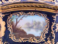 A Sèvres Style Painted and Parcel Gilt Porcelain Table Casket