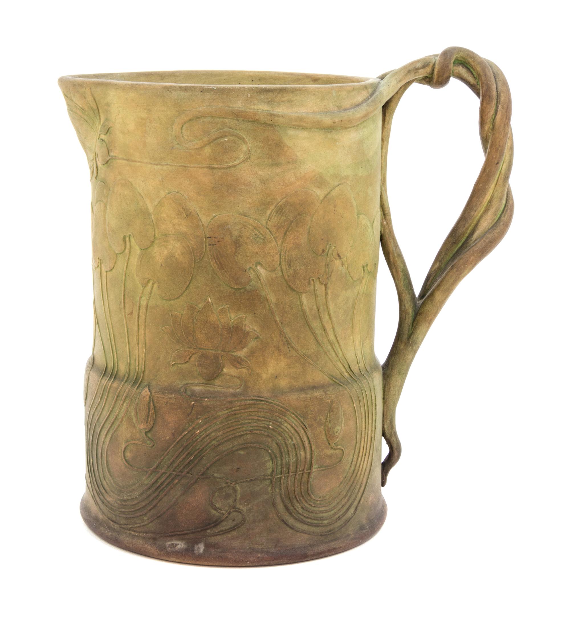 An Art Nouveau Ceramic Ewer Height 7 1/8 inches.
