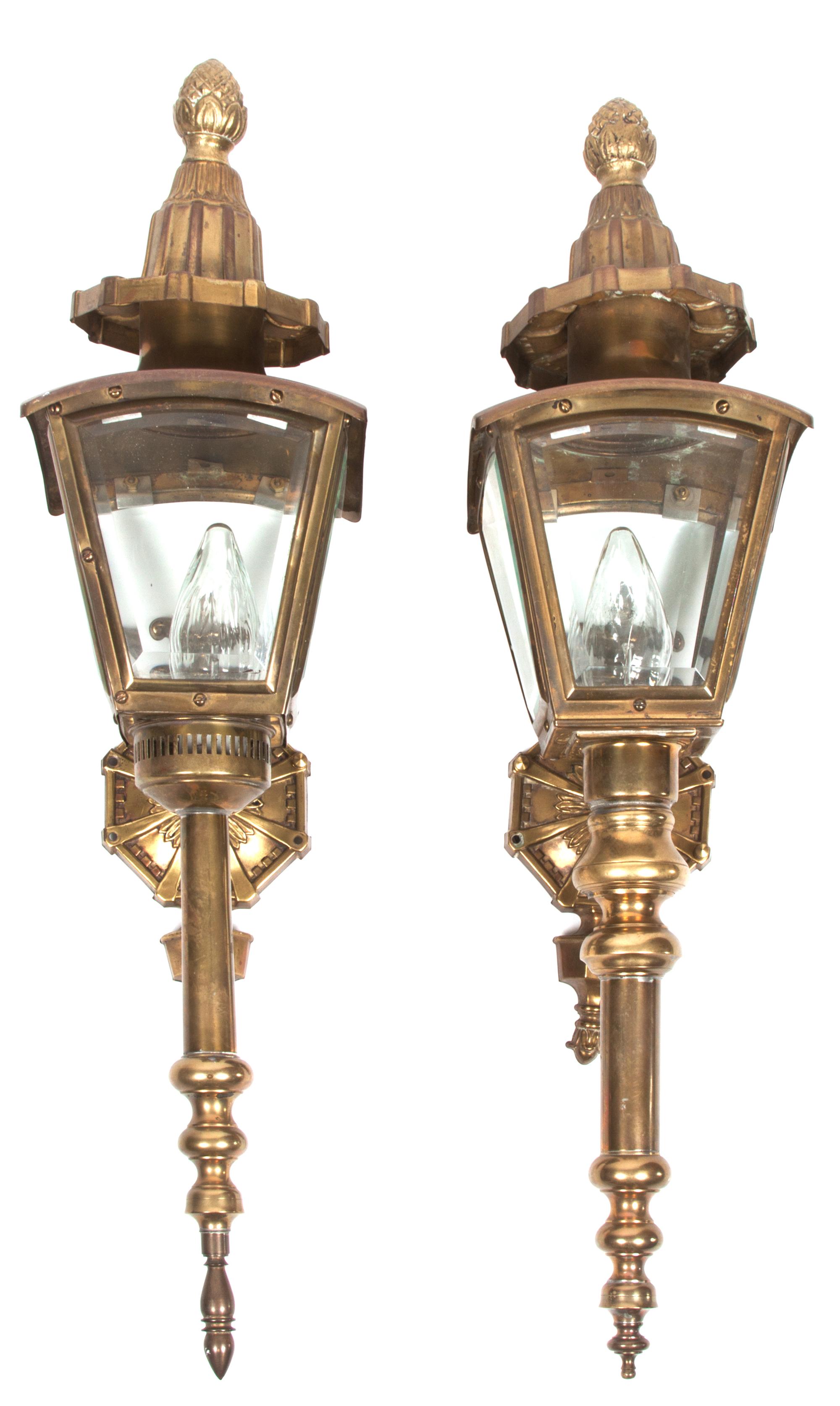 A Pair of Brass Carriage Lanterns Height 26 1/2 inches.