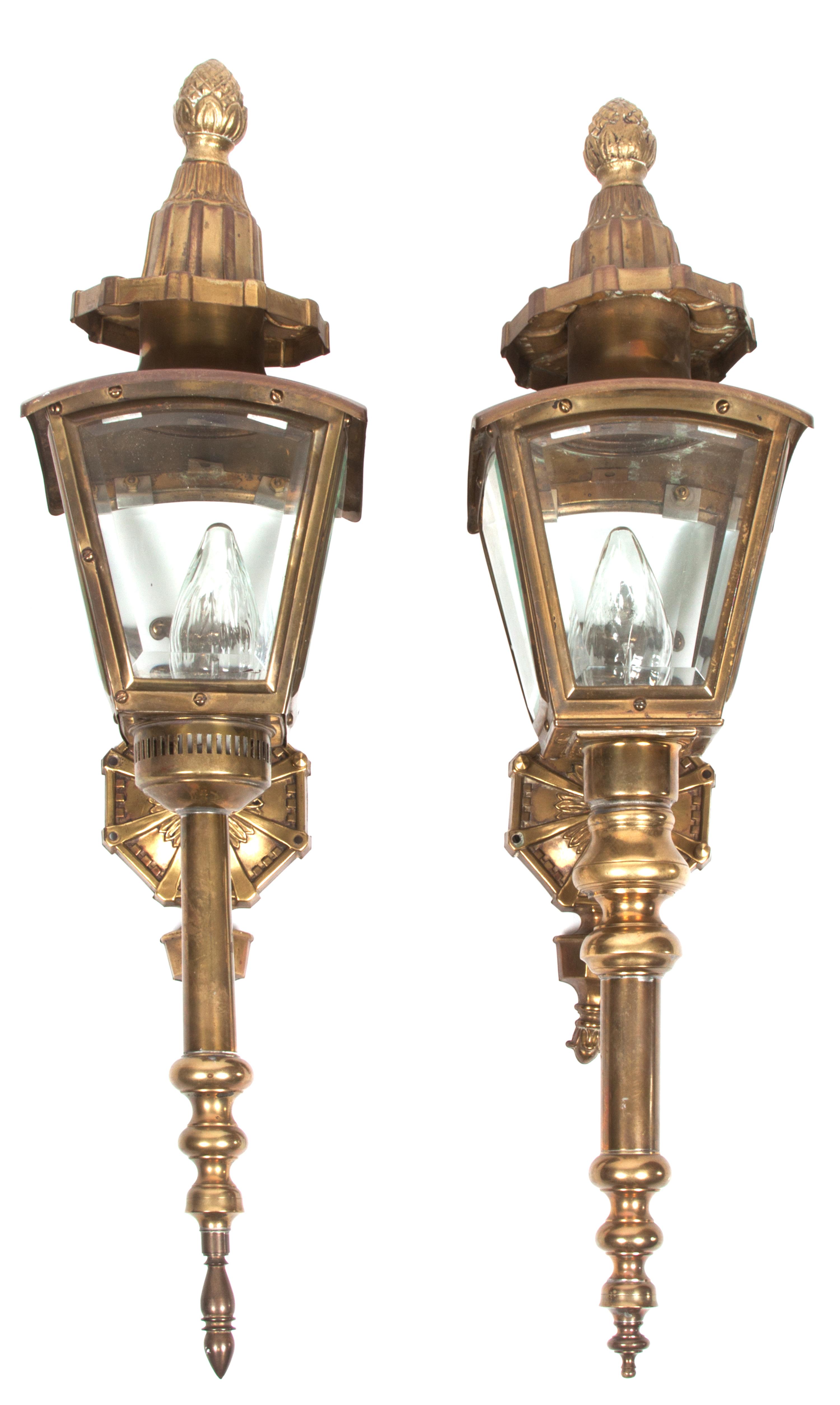 A Pair of Brass Carriage Lanterns Height 26 1/2 inches.