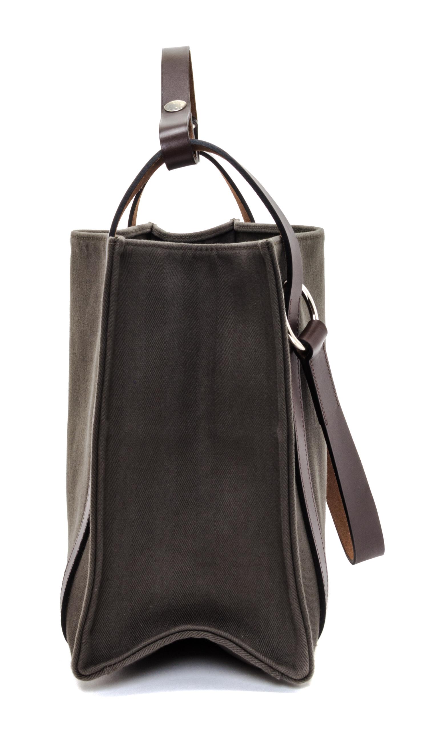 An Hermes Vert de Gris Canvas and Ebene Vache Cabalicol Tote, 15.5" x 11.5" x 6.5".