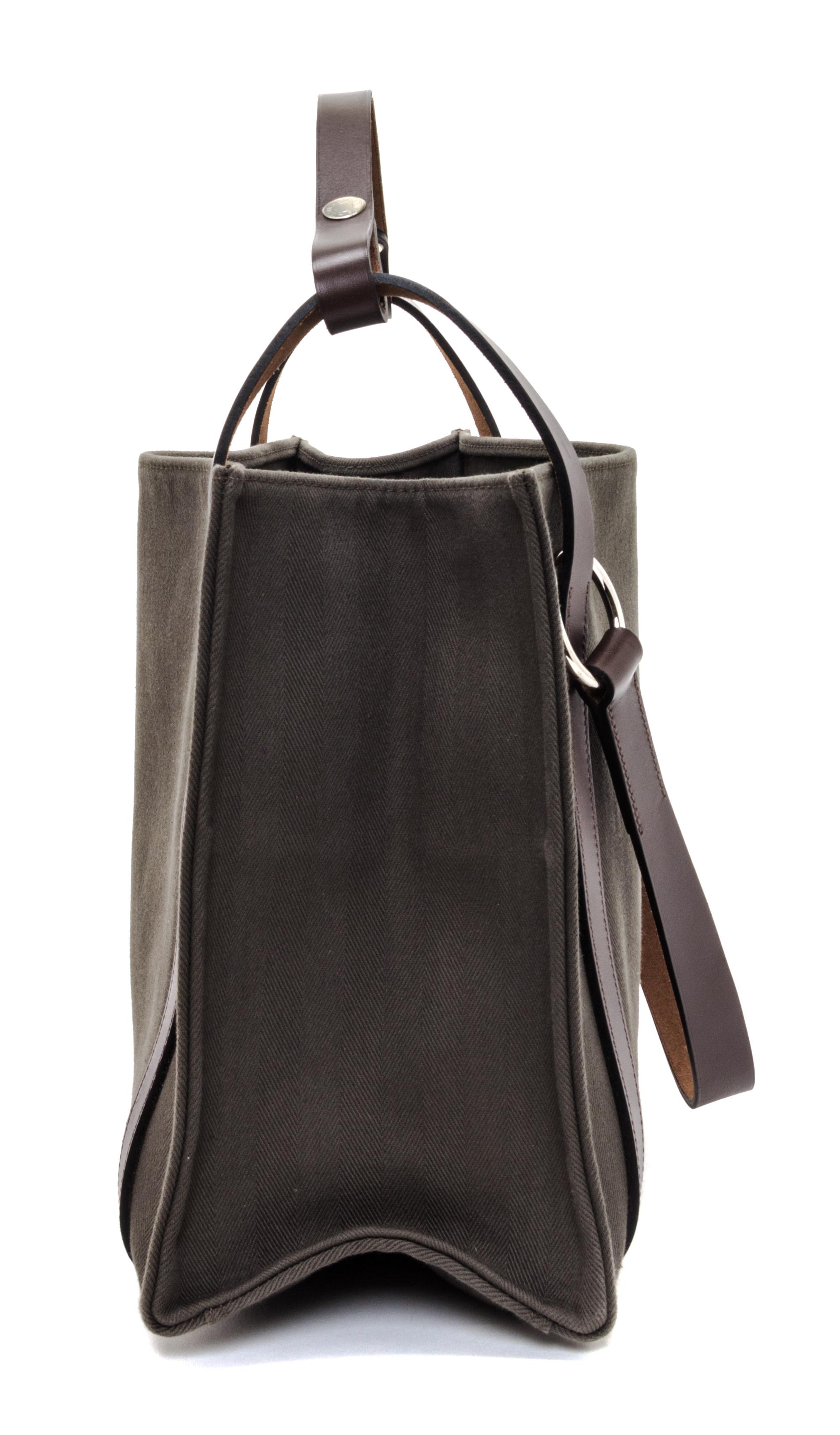 An Hermes Vert de Gris Canvas and Ebene Vache Cabalicol Tote, 15.5" x 11.5" x 6.5".