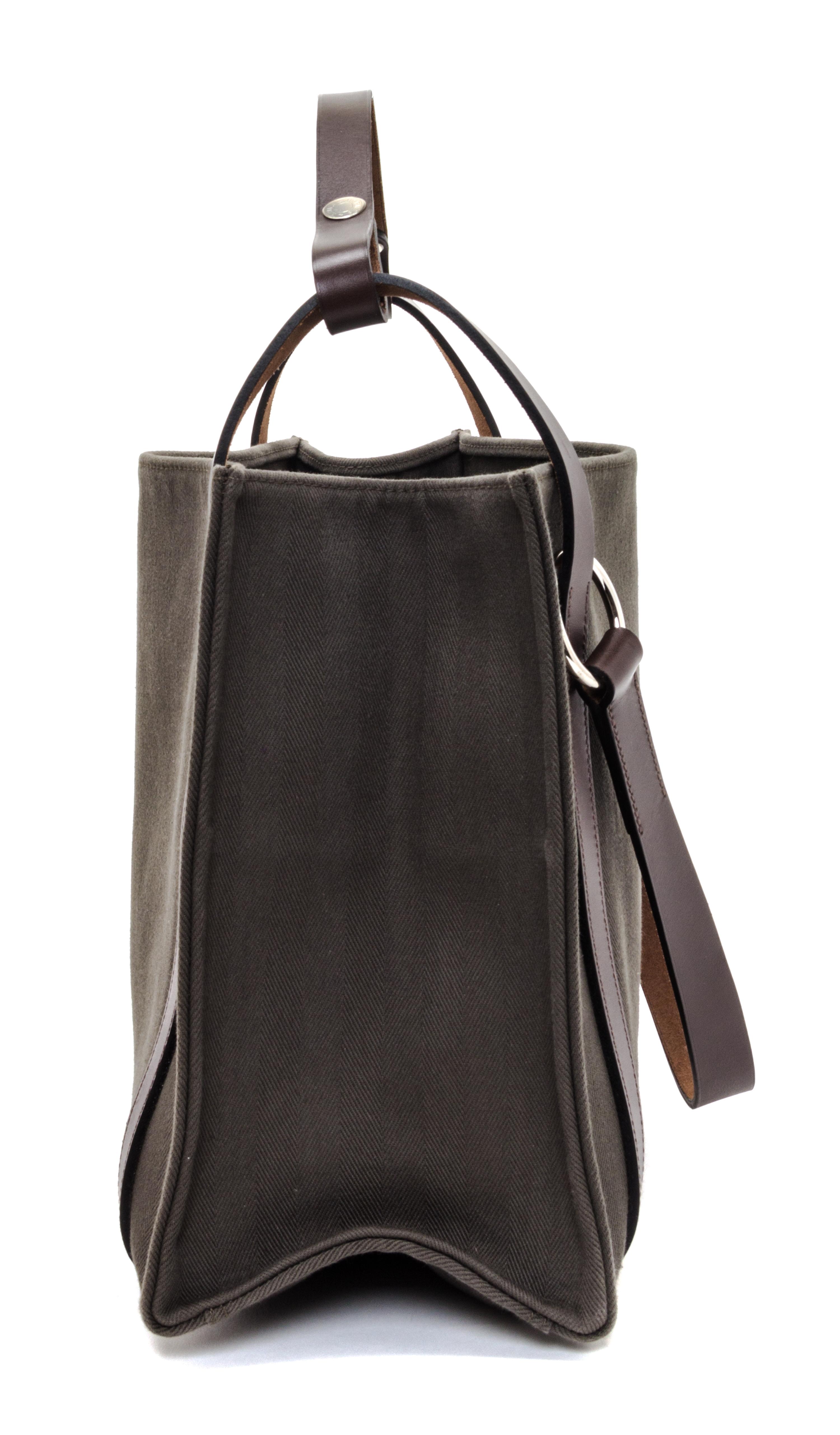 An Hermes Vert de Gris Canvas and Ebene Vache Cabalicol Tote, 15.5" x 11.5" x 6.5".