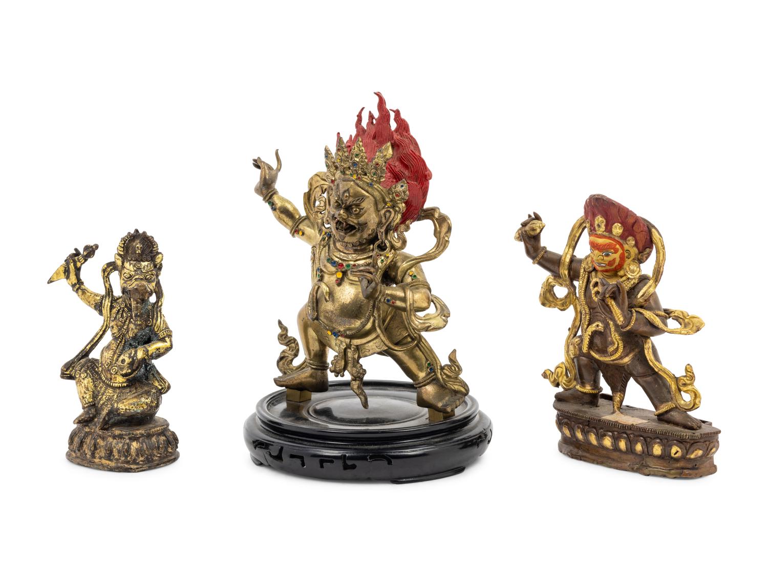 Three Tibetan Gilt Bronze Figures of Guardians