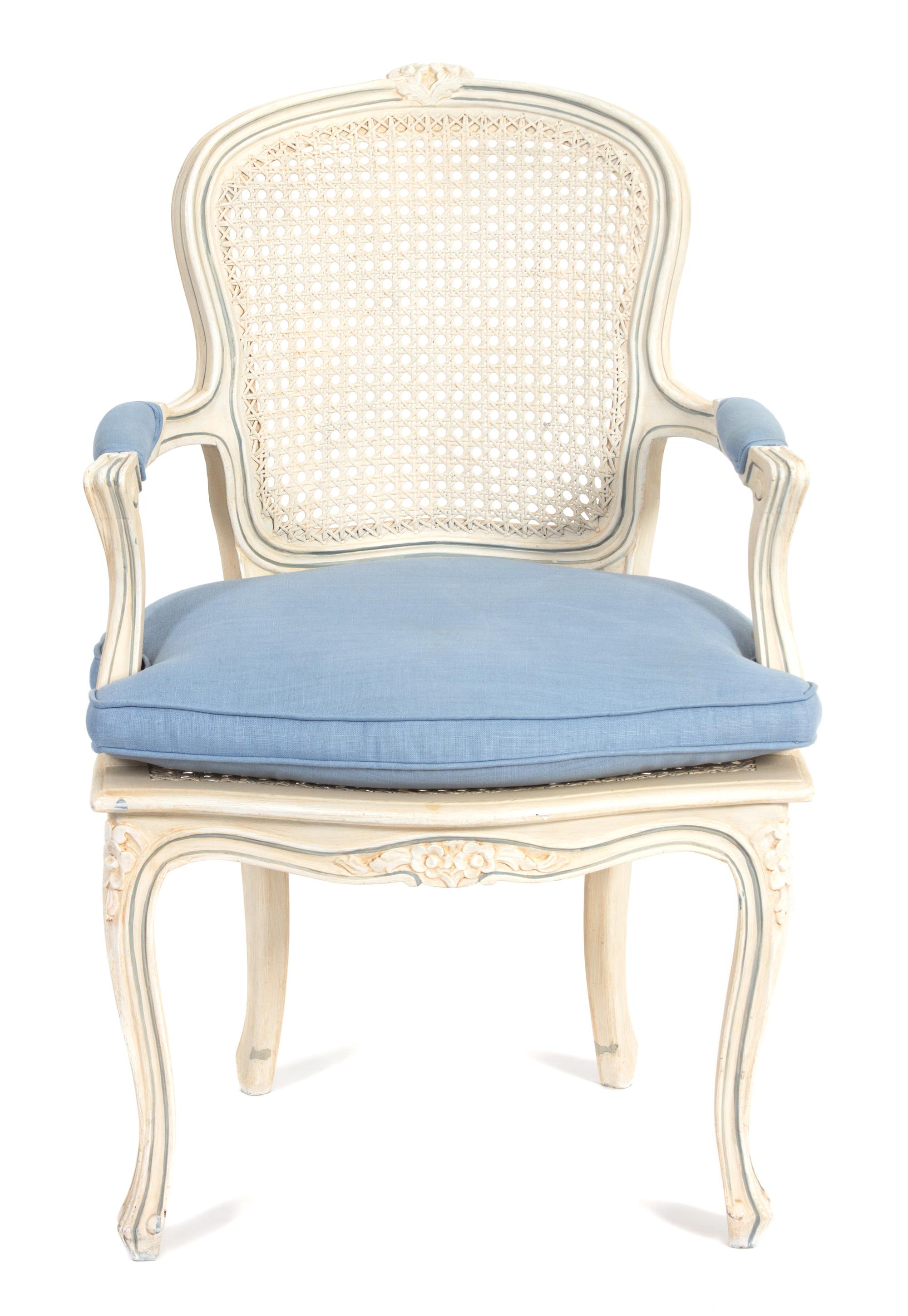 A Louis XV Style Carved and Painted Cane Back and Seat Fauteuil Height 36 inches. — 20TH CENTURY