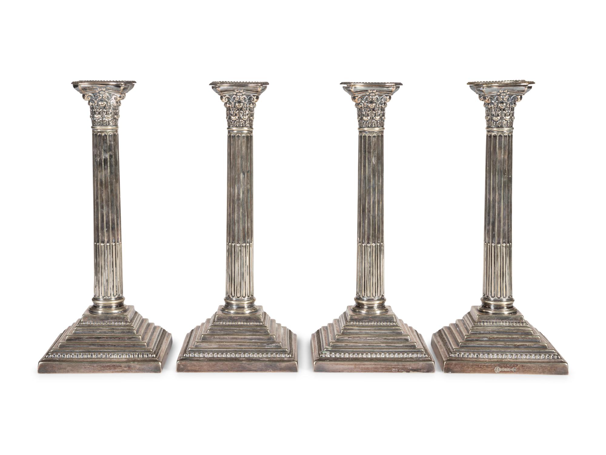 A Set of Four English Silver-Plate Candlesticks