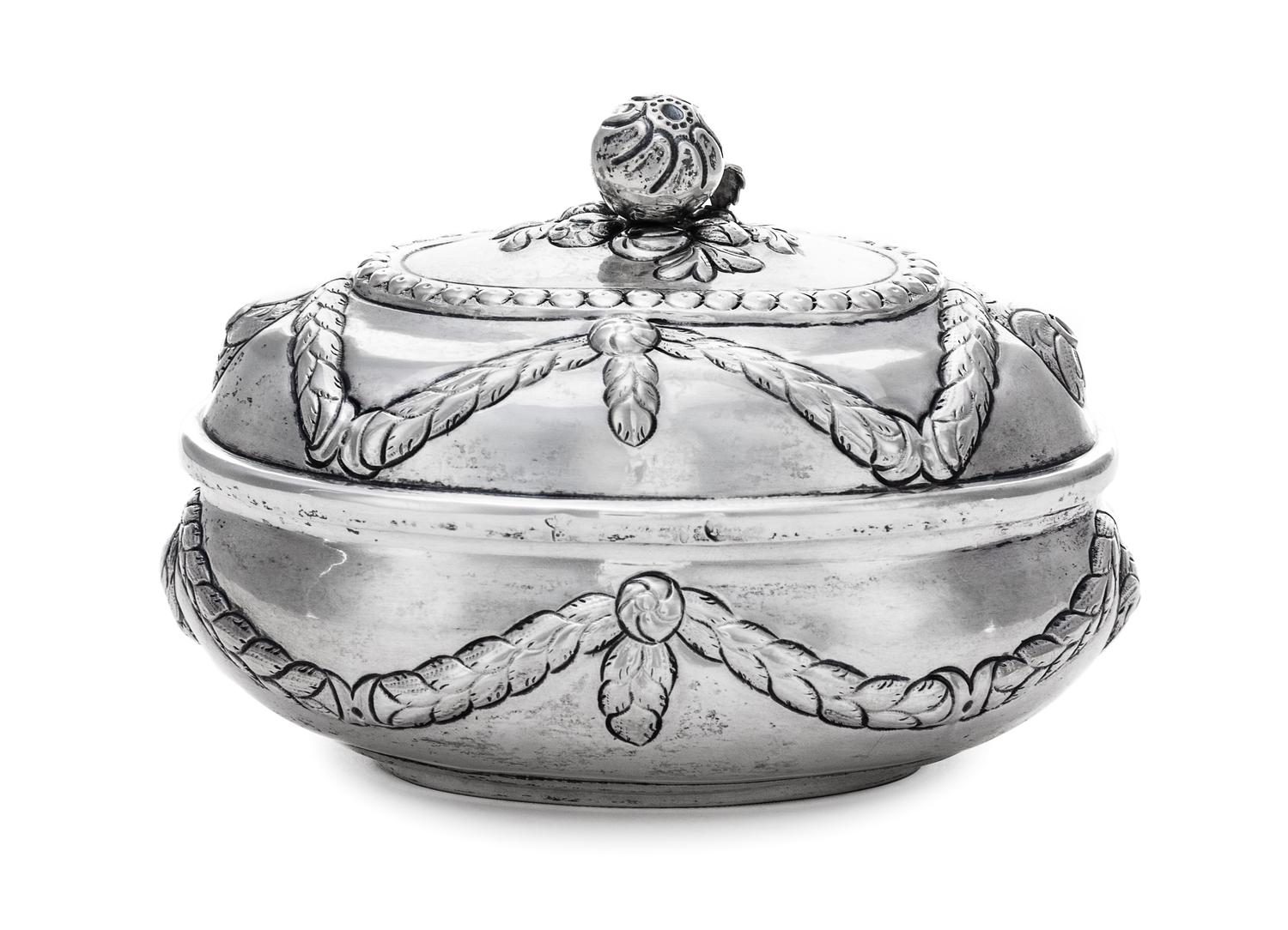 A German Silver Oval Sugar Box, Maker's marks obscured, Hanau, 19th Century, the hinged oval box worked with repousse husk garland swag