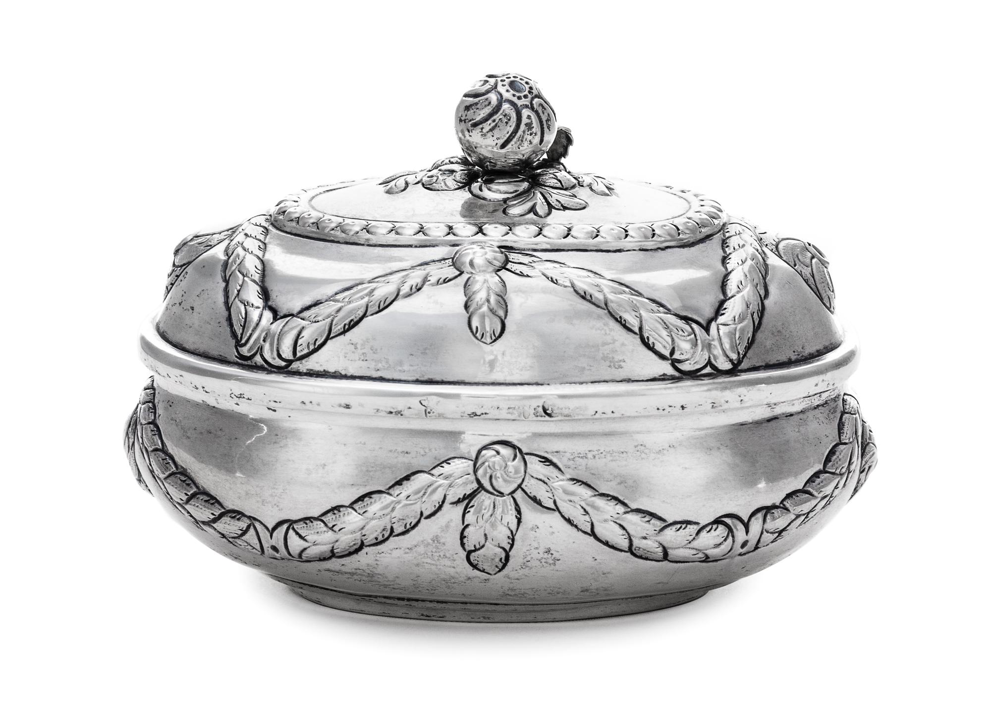 A German Silver Oval Sugar Box, Maker's marks obscured, Hanau, 19th Century, the hinged oval box worked with repousse husk garland swag