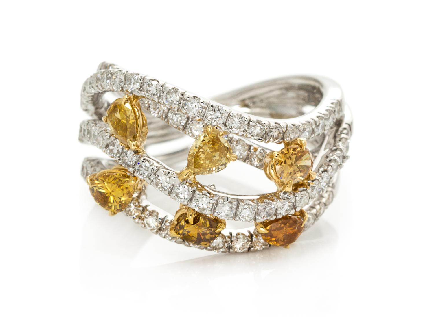An 18 Karat White Gold, Colored Diamond and Diamond Ring, 5.40 dwts.