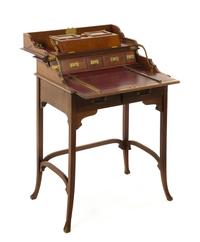 An English Mahogany Lady's Mechanical Writing Desk, Height 32 3/4 x width 25 3/4 x depth 17 1/2 inches.