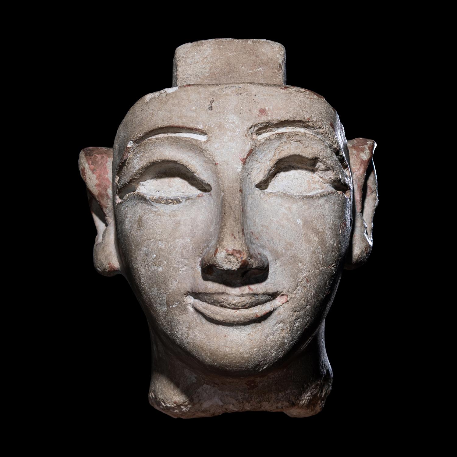 An Egyptian Limestone Head from a Composite Statue