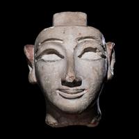 An Egyptian Limestone Head from a Composite Statue