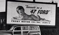 Philippe Halsman (1906-1997) Untitled ("Smooth as a 47 Ford" Billboard), c. 1947
