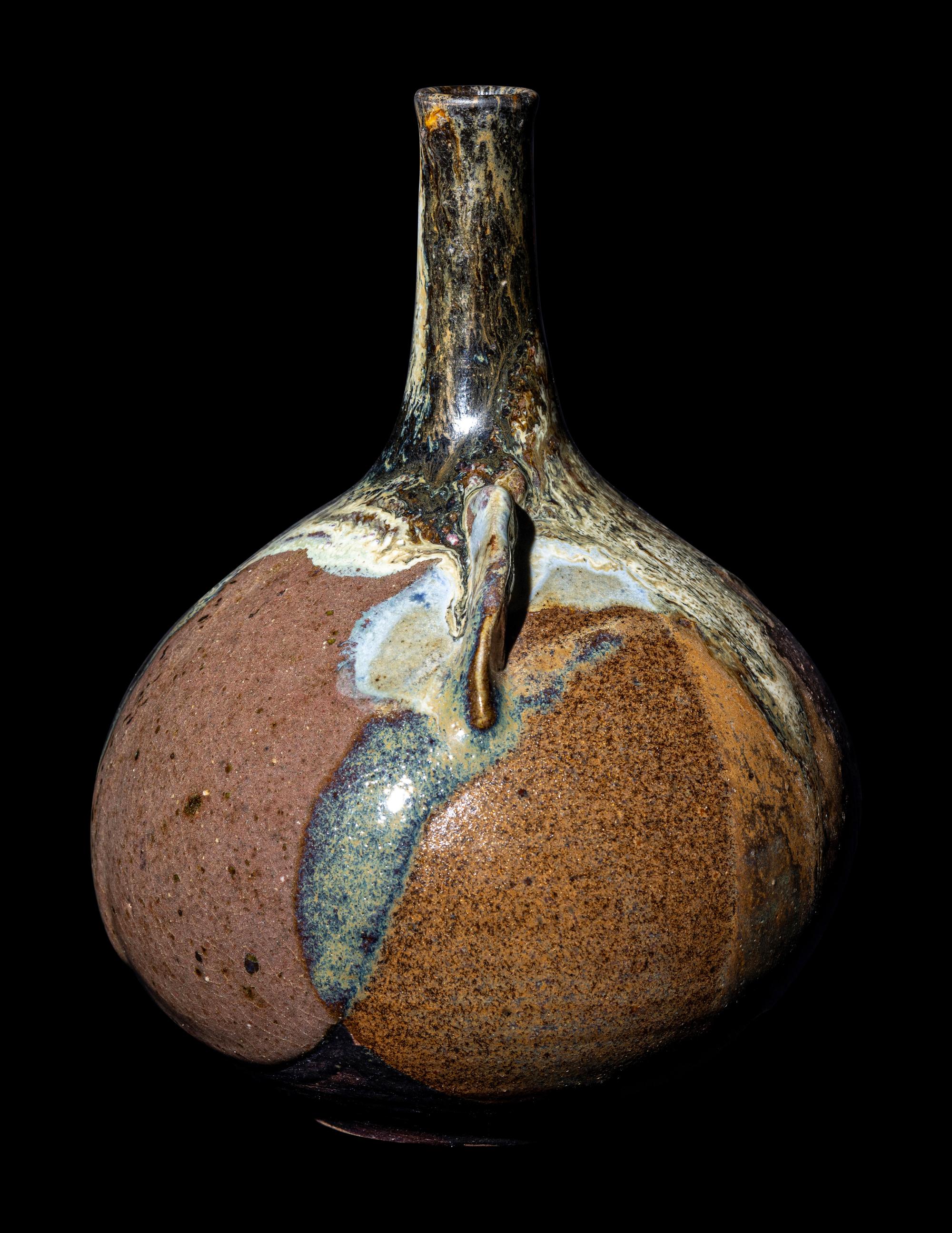 A Japanese Dark Brown Glazed Stoneware Bottle Vase