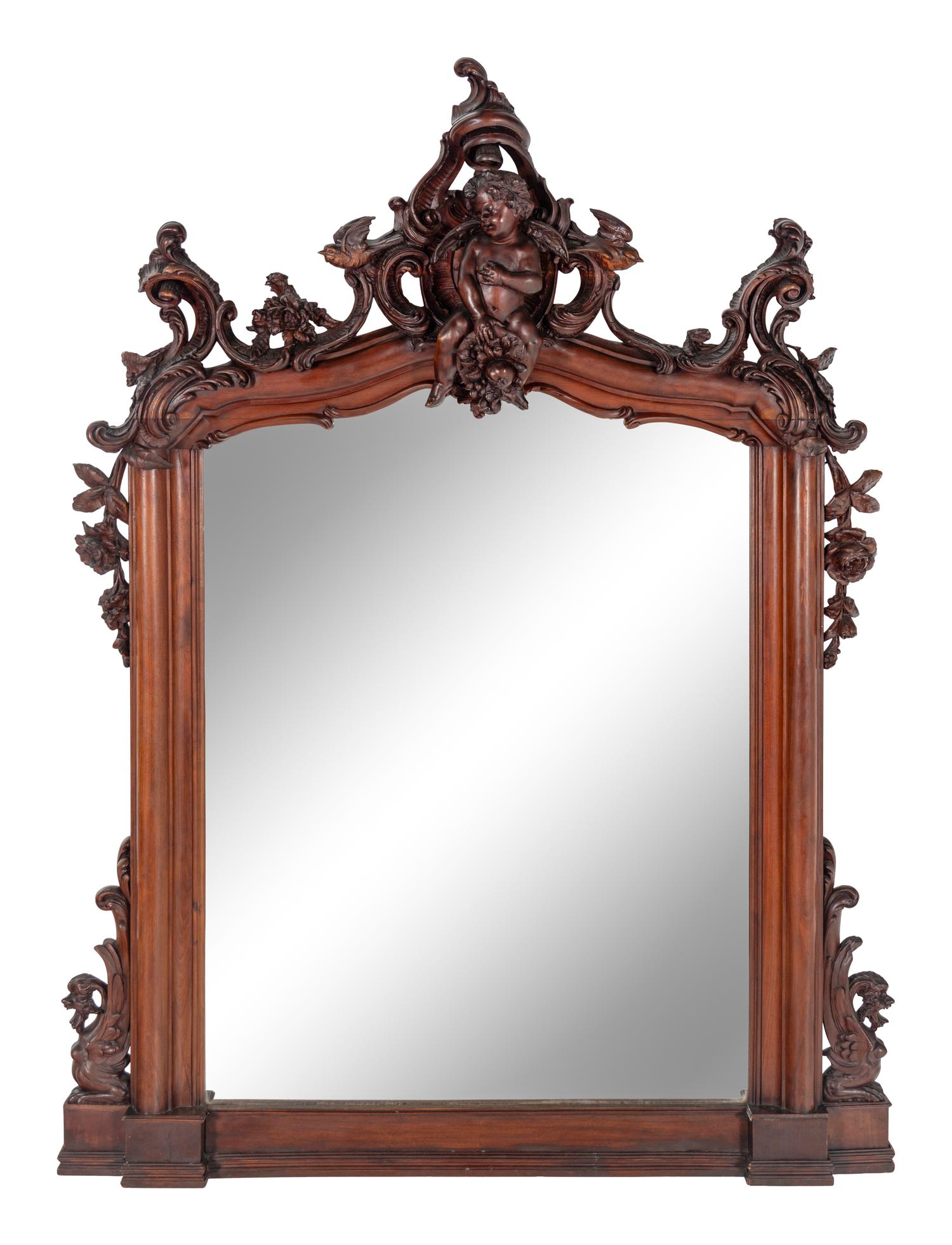 An Italian Rococo Revival Carved Walnut Mirror