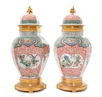 A Pair of French Gilt Bronze Mounted Porcelain Covered Vases Height overall 20 3/4 inches. — 20TH CENTURY