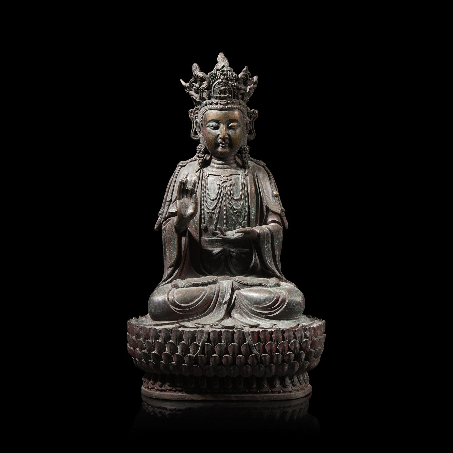 A Chinese Patinated Bronze Figure of a Seated Bodhisattva 銅觀音坐像