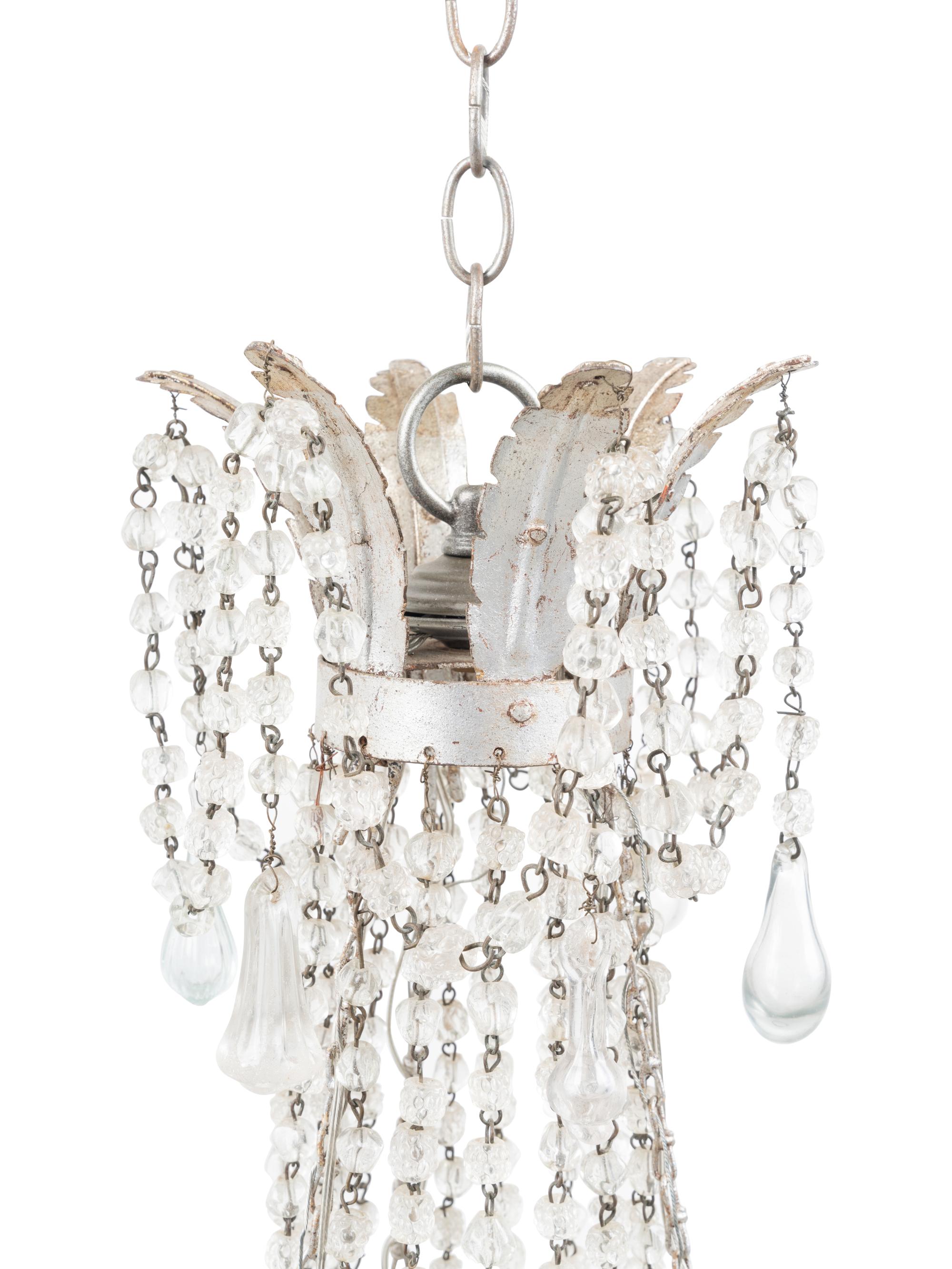 A Silvered Metal Eight-Light Chandelier