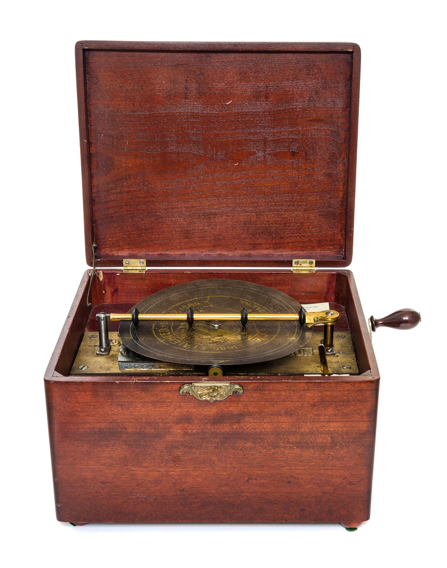 A Symphonium Disk Music Box Height 8 x width 11 5/8 x depth 9 3/4 inches. — LATE 19TH CENTURY