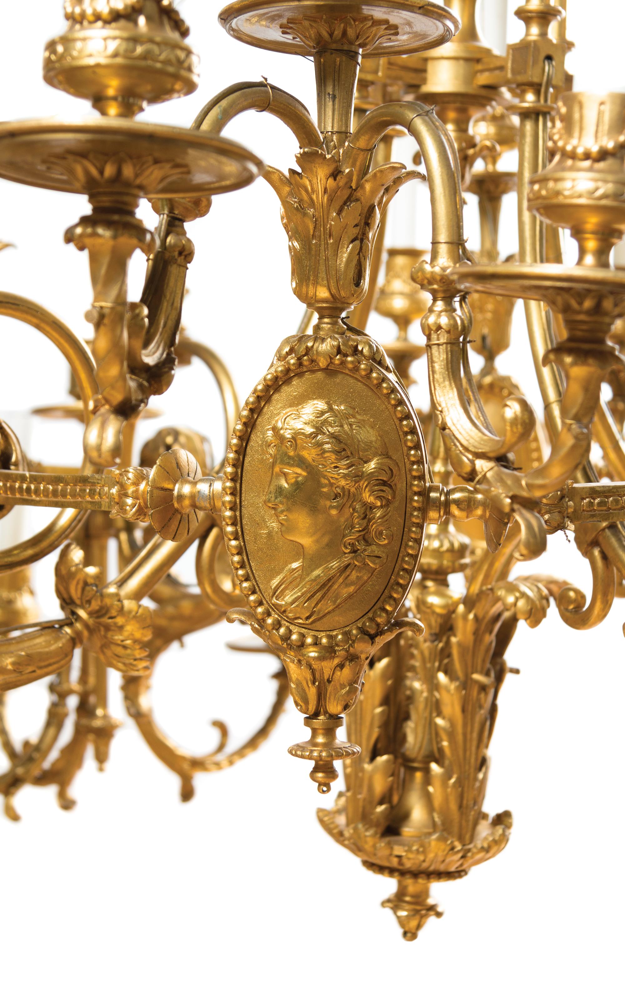 A Neoclassical Gilt Bronze Twenty-Eight-Light Chandelier Height 42 x diameter 37 inches.