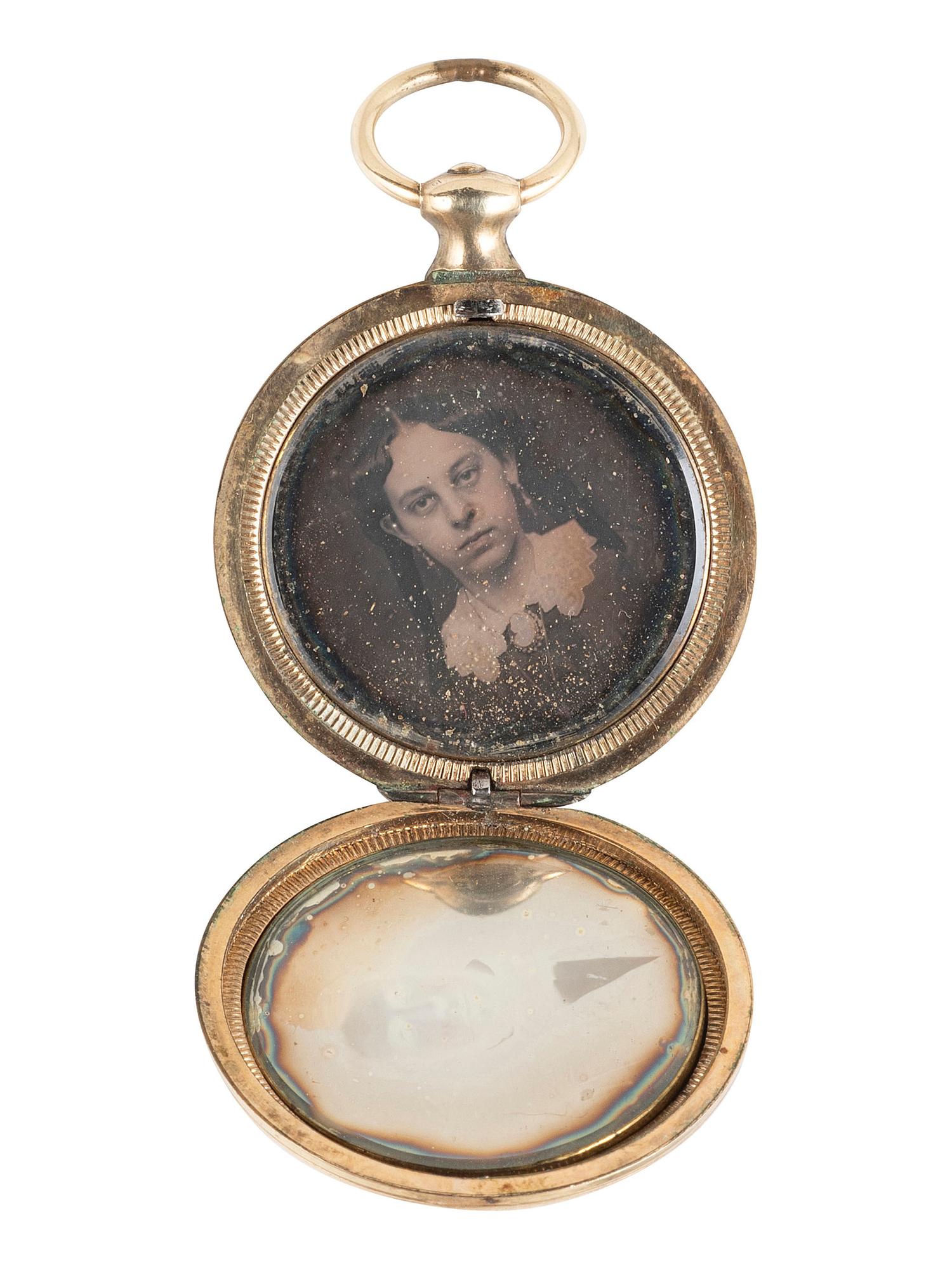 [EARLY PHOTOGRAPHY]. 11 lockets containing daguerreotypes and tintypes.