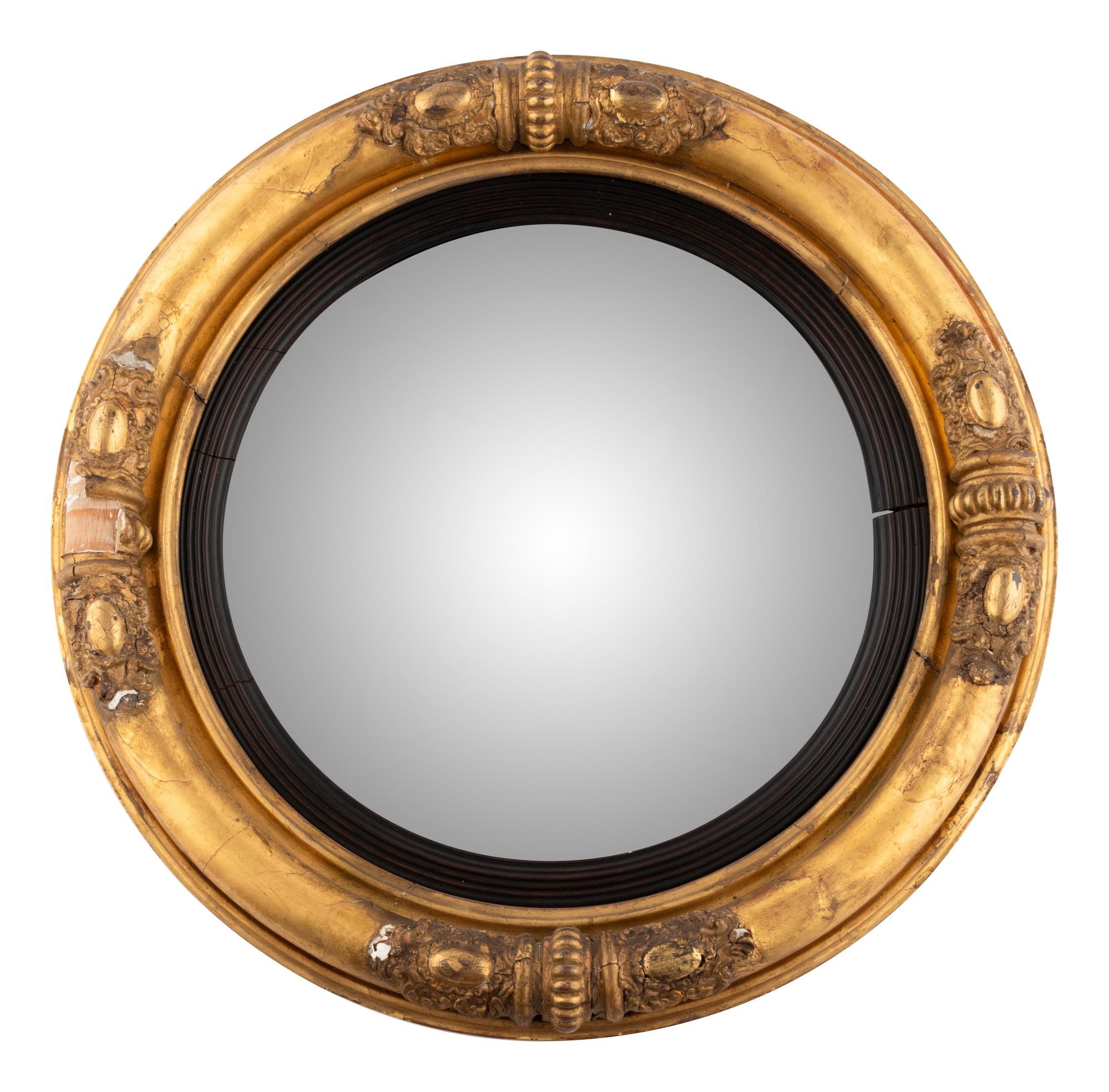 A Classical Carved Giltwood and Gesso Bull's Eye Mirror