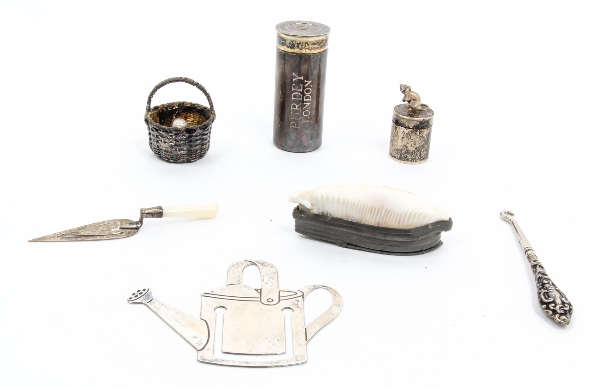 Three English Silver Articles, 20TH CENTURY, comprising a shotgun shell coin holder, James Purdey & Sons, a small jar with mouse form f