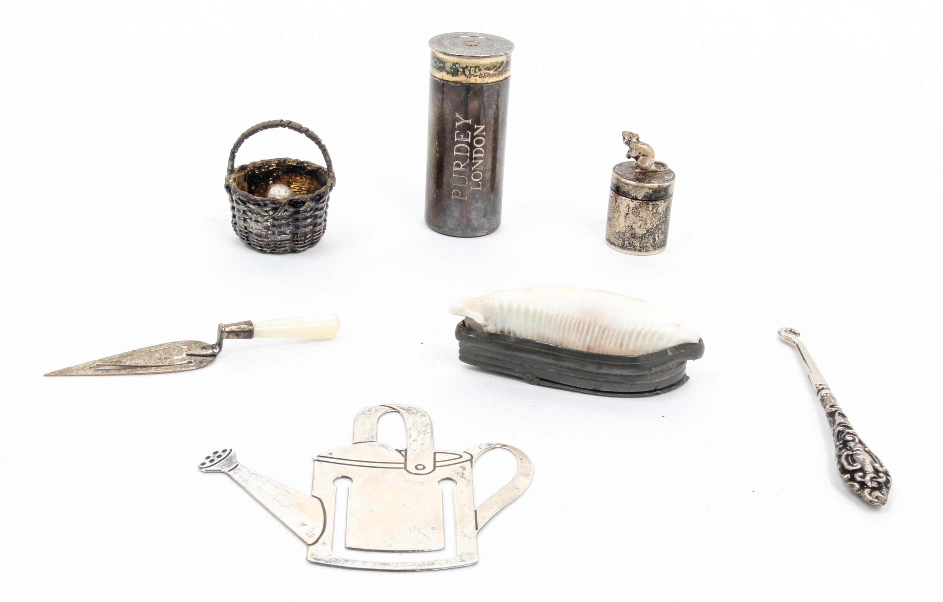 Three English Silver Articles, 20TH CENTURY, comprising a shotgun shell coin holder, James Purdey & Sons, a small jar with mouse form f
