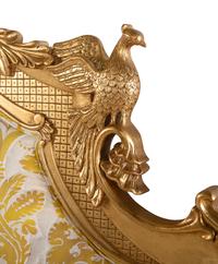 A Giltwood Headboard with Fortuny Upholstery