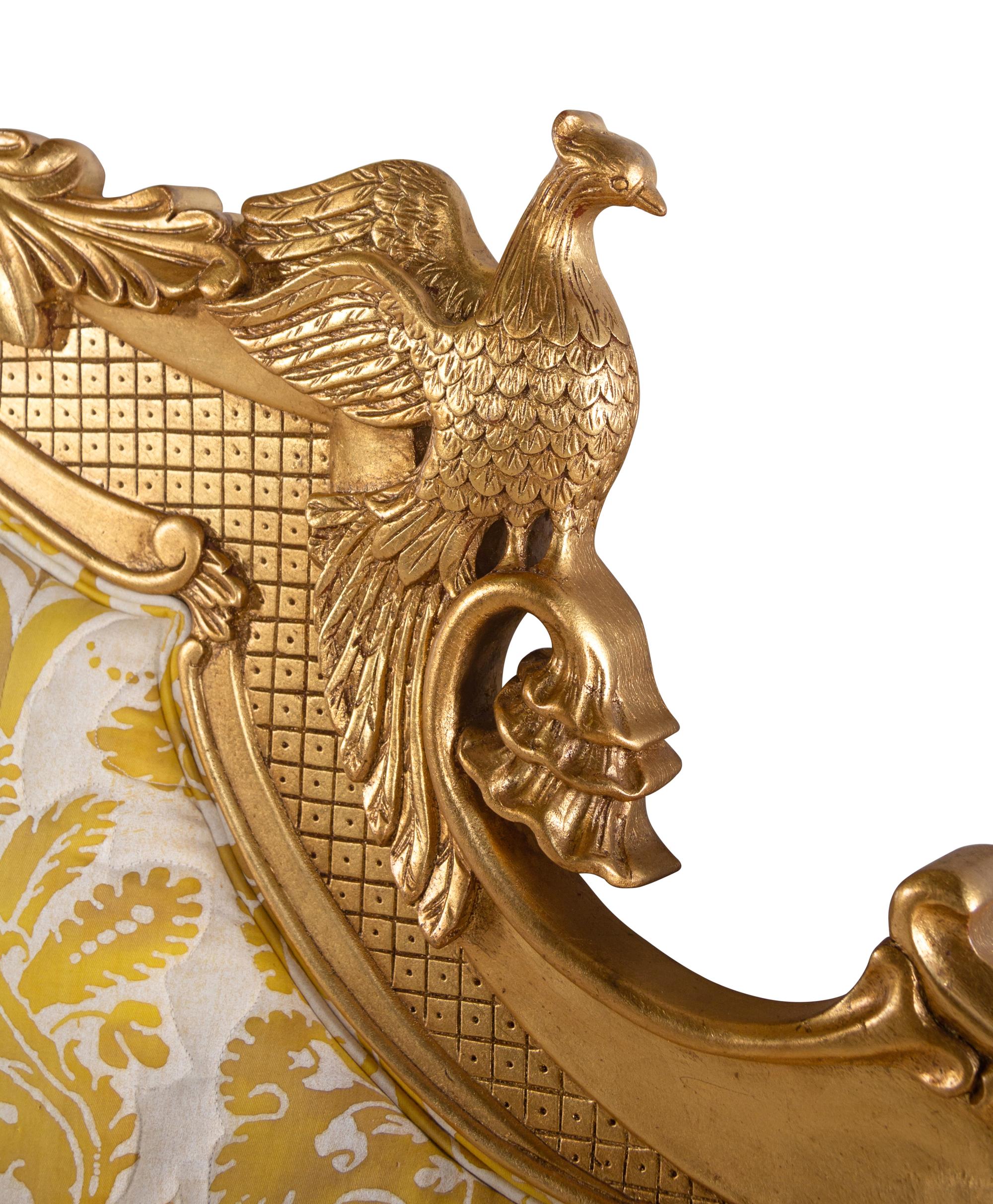 A Giltwood Headboard with Fortuny Upholstery