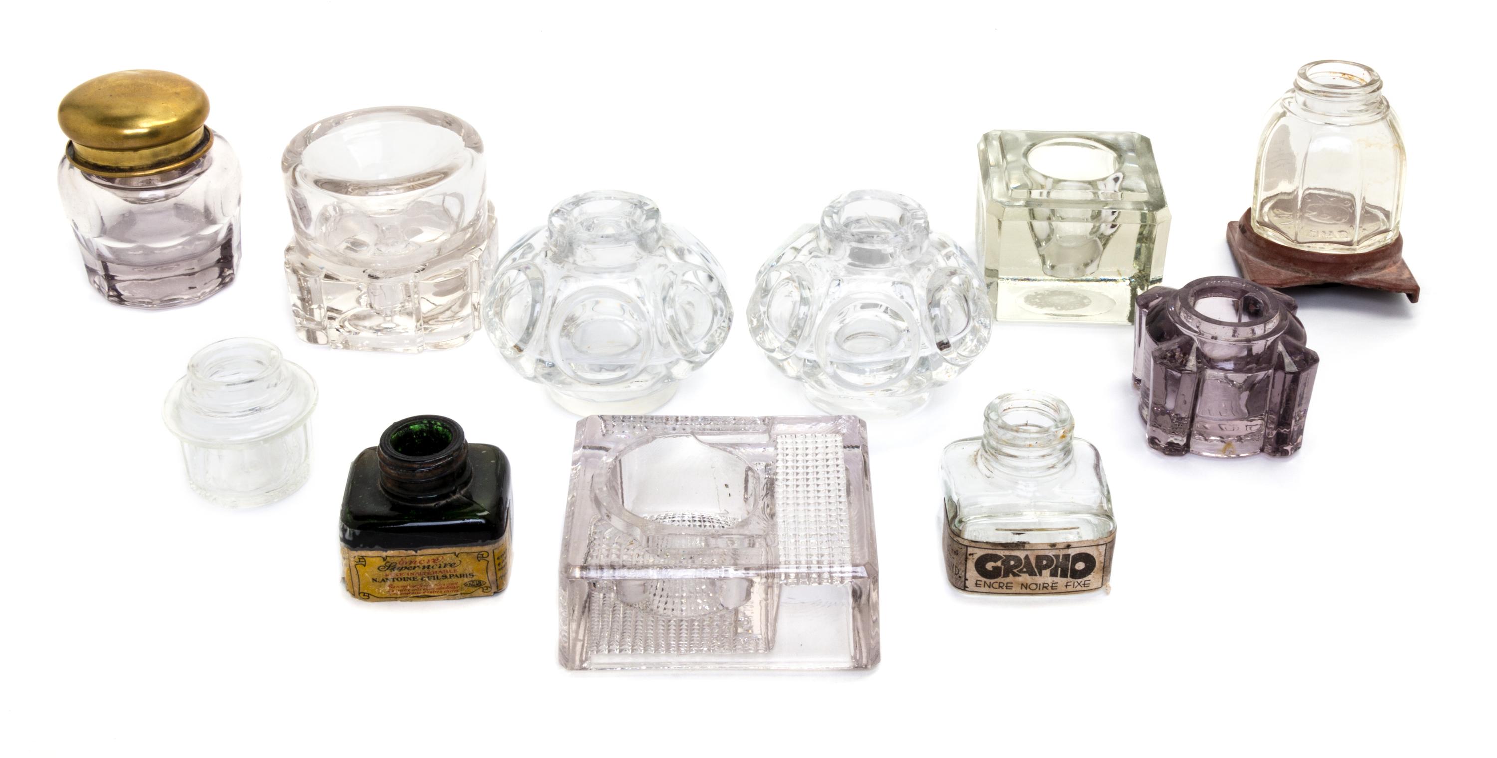 An Assembled Group of Eleven Glass Inkwells and Ink Bottles Height of tallest 2 3/4 inches.