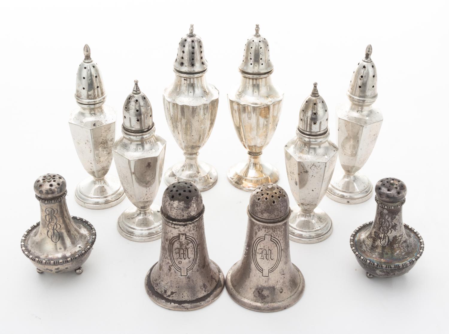 A Collection of American Silver Casters Height of tallest pair 5 1/4 inches. — 20th Century