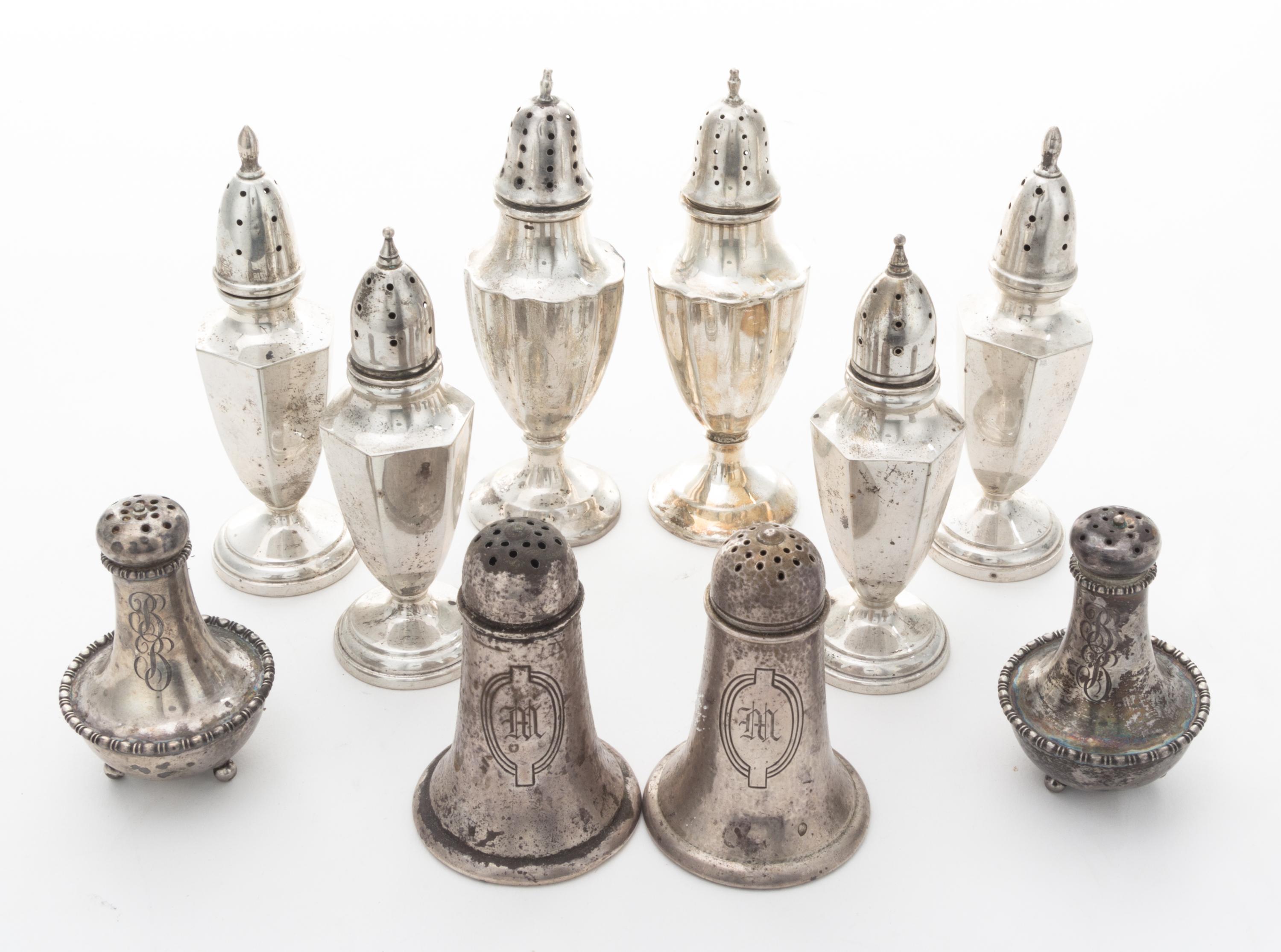 A Collection of American Silver Casters Height of tallest pair 5 1/4 inches. — 20th Century