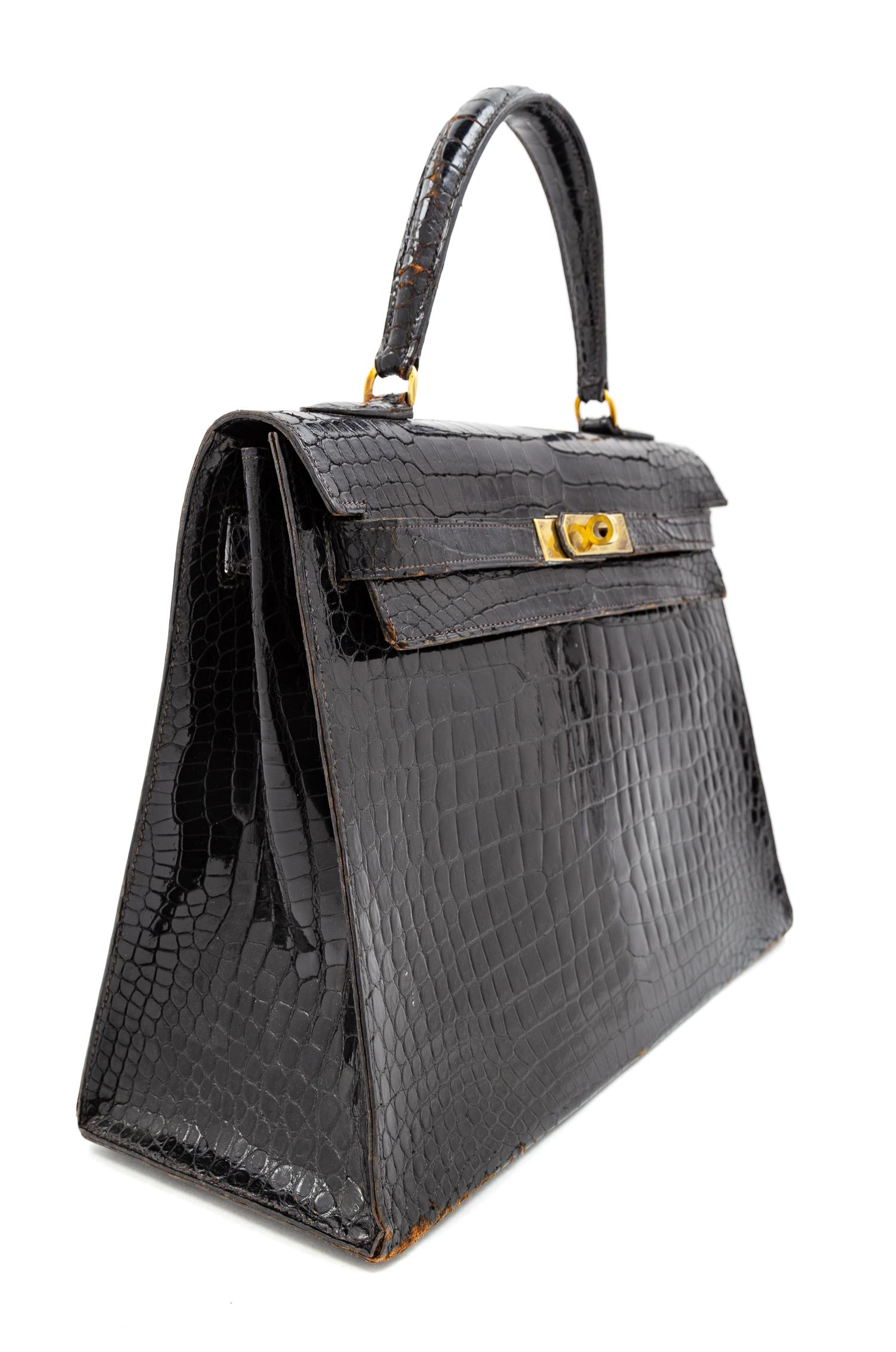 An Hermès Vintage Black Crocodile Kelly Bag, 9" L x 13" W x 4.5" D; Handle drop: 4.5".