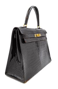 An Hermès Vintage Black Crocodile Kelly Bag, 9" L x 13" W x 4.5" D; Handle drop: 4.5".