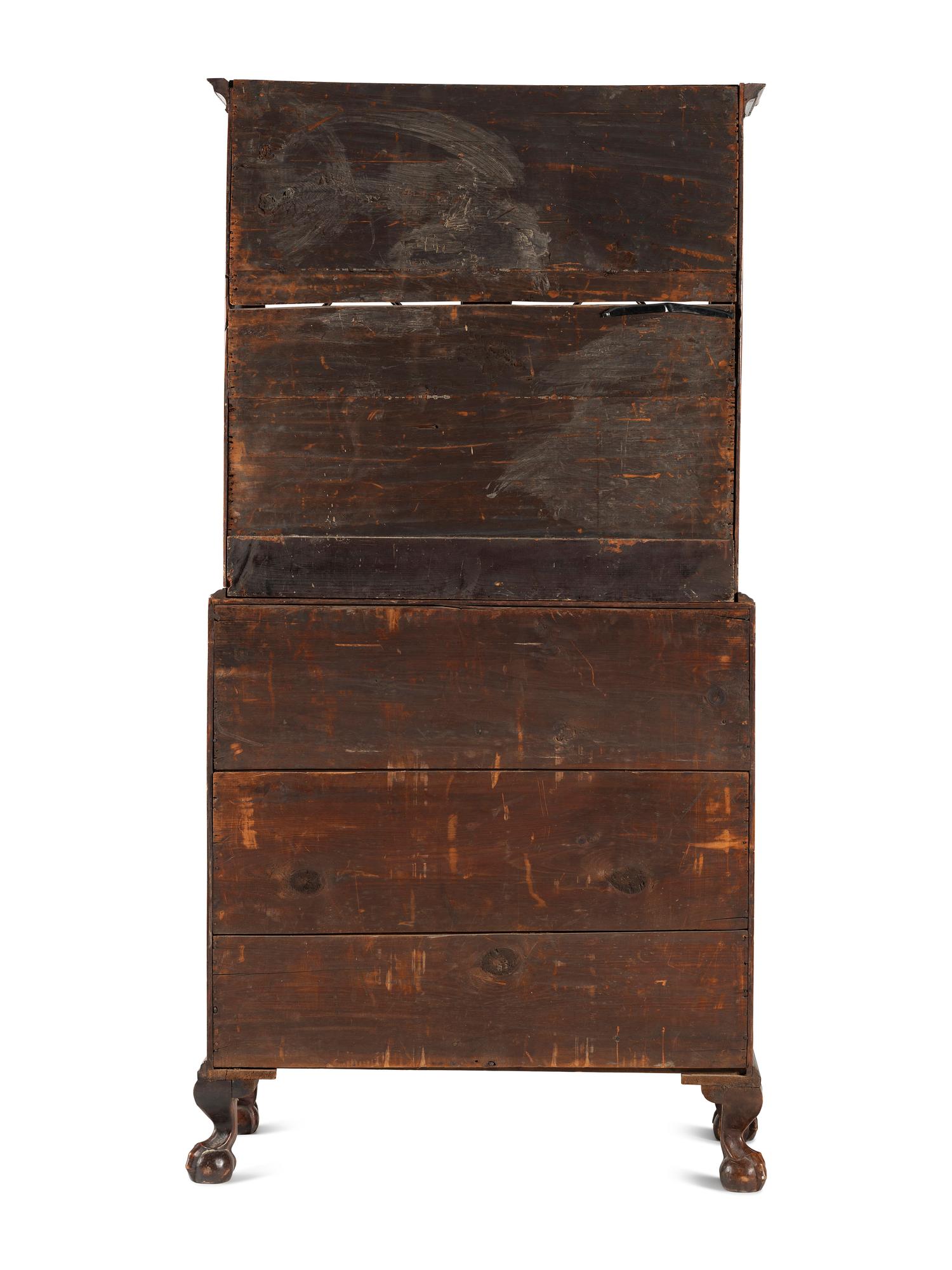 A Chippendale Mahogany and Cherrywood Serpentine Claw-and-Ball Foot Desk-and-Bookcase