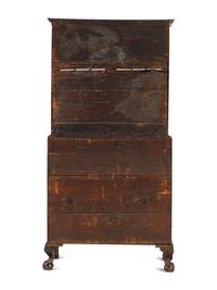 A Chippendale Mahogany and Cherrywood Serpentine Claw-and-Ball Foot Desk-and-Bookcase