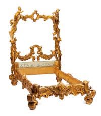 A Venetian Carved and Parcel Gilt Bed Frame