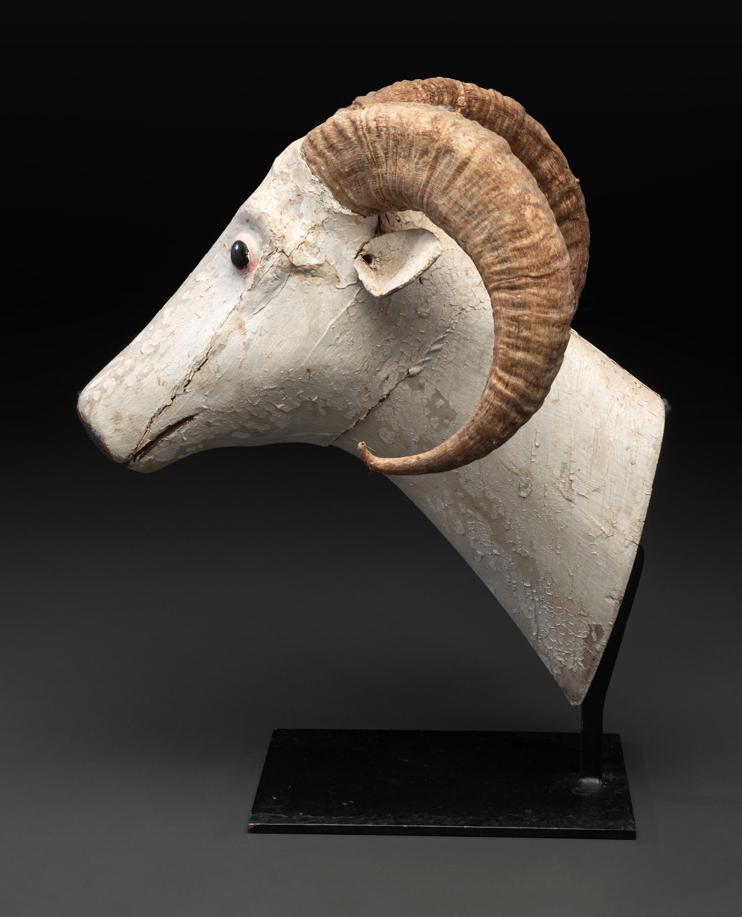 A Folk Art Carved and Painted Wood Ram's Head